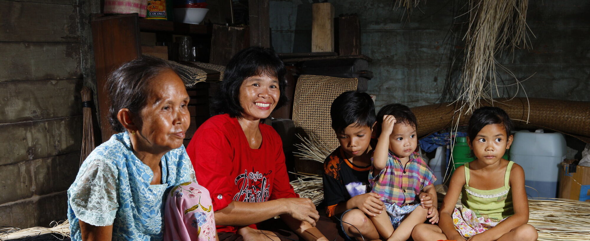 ibu nela (in red) is the head of the braiding group in mandomai;